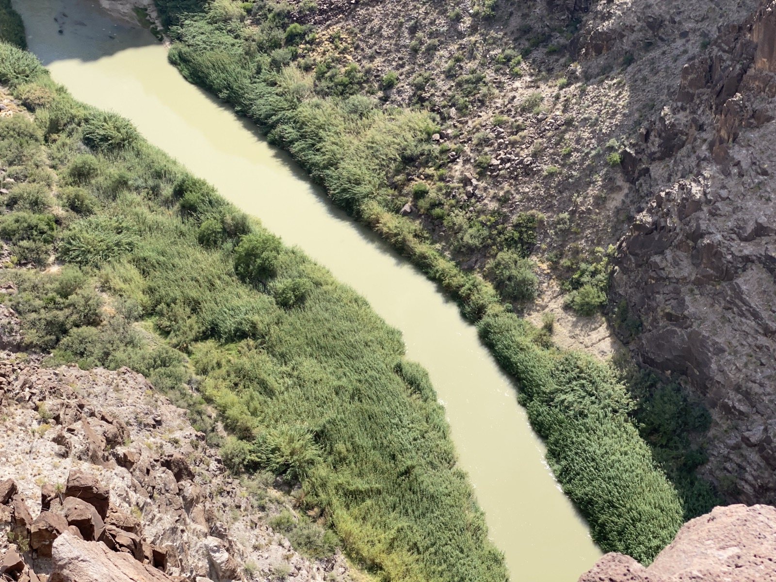 Tropical rocky shoreline at golden hour